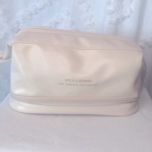 AYAIM travel bag for cosmetics and brushes. Layer at bottom to hold brushes.